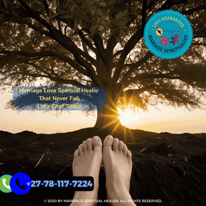 Bare feet pressing into soil beneath a tree at sunset. (1)